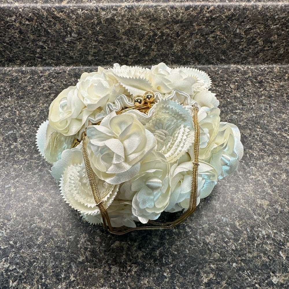 Sondra Roberts ivory silk floral clutch purse. Gold chain handle and hardware
